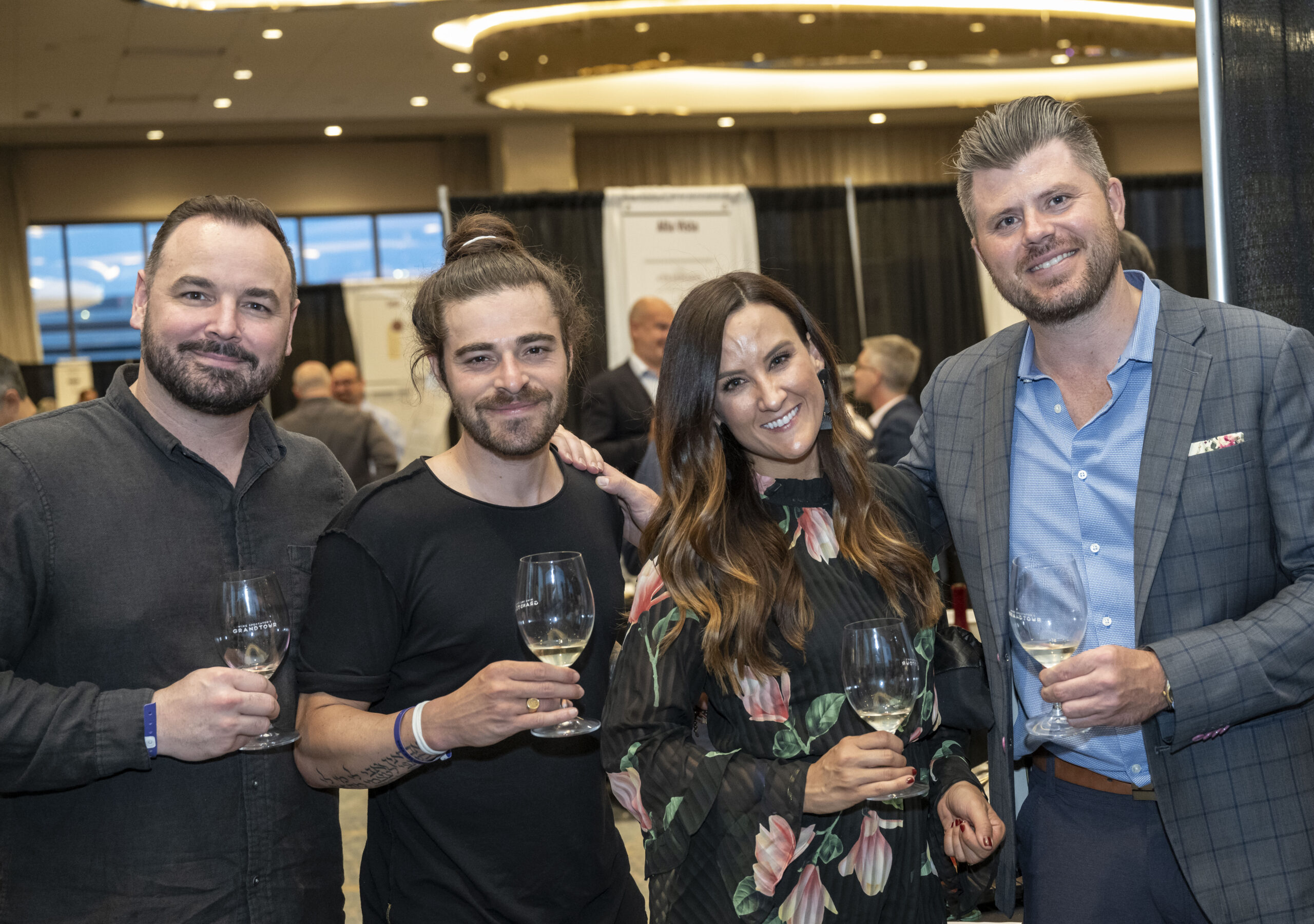 Attendees drinking wines